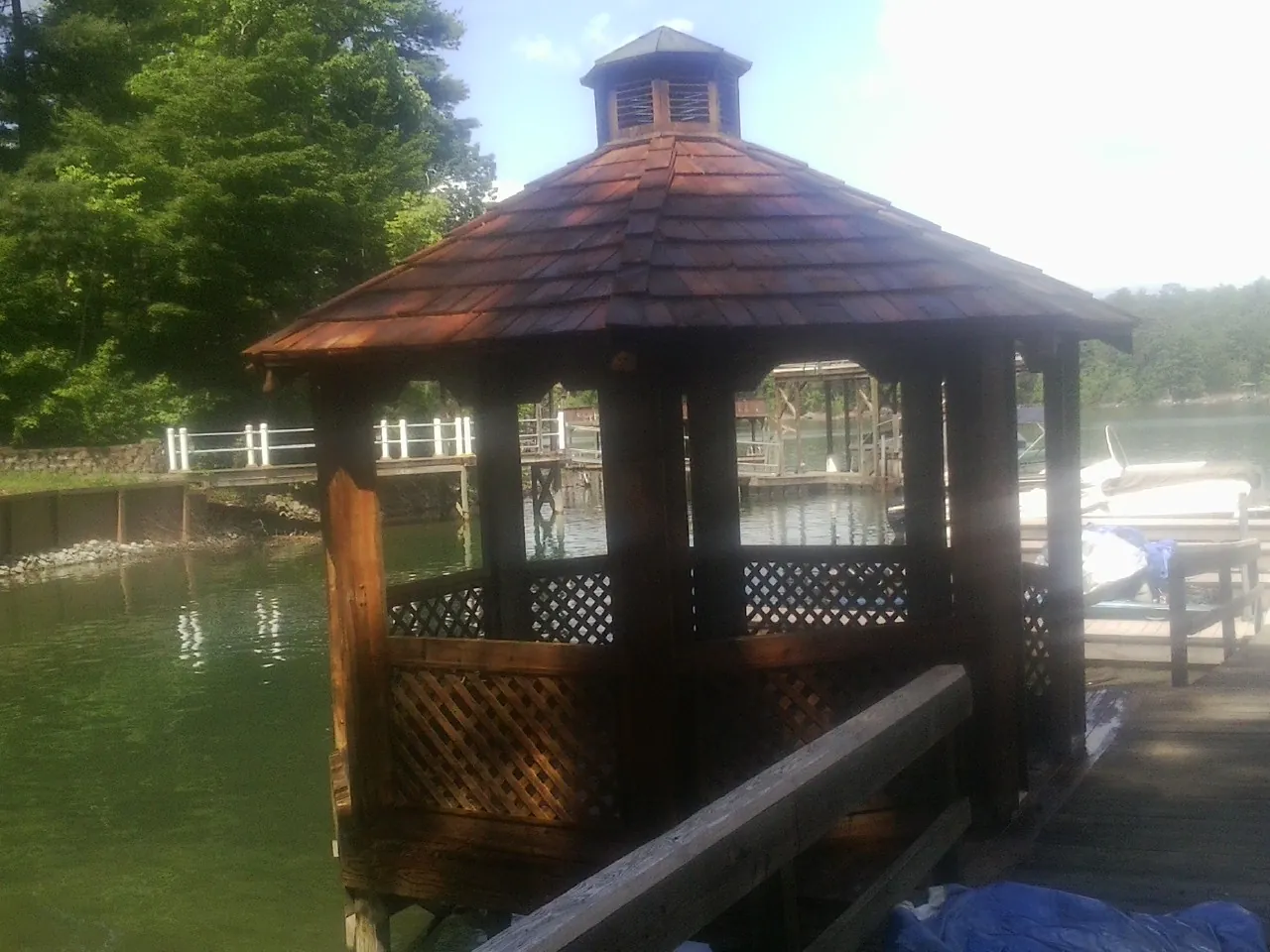 Cedar shake gazebo roof rebuilt on a lake dock in Spruce Creek