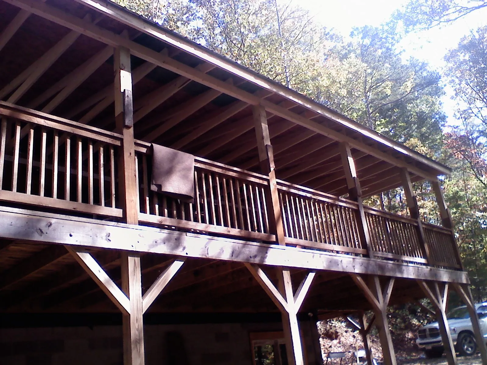 Timber framing under a new elevated porch and deck — Roof Leak Repair in Spruce Creek by Roofing Brothers